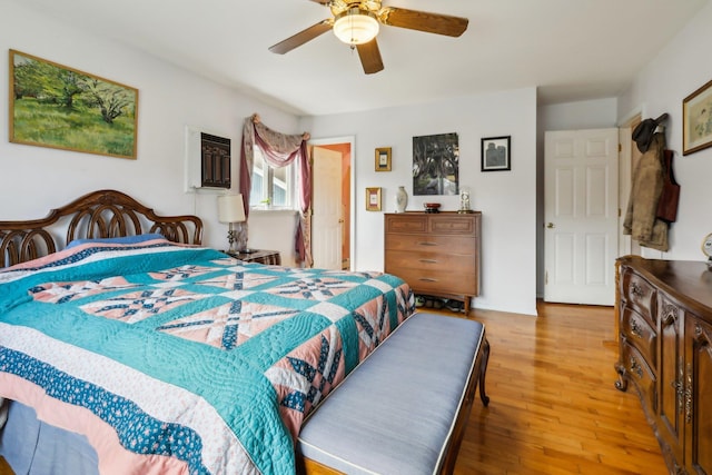 bedroom with a ceiling fan and wood finished floors