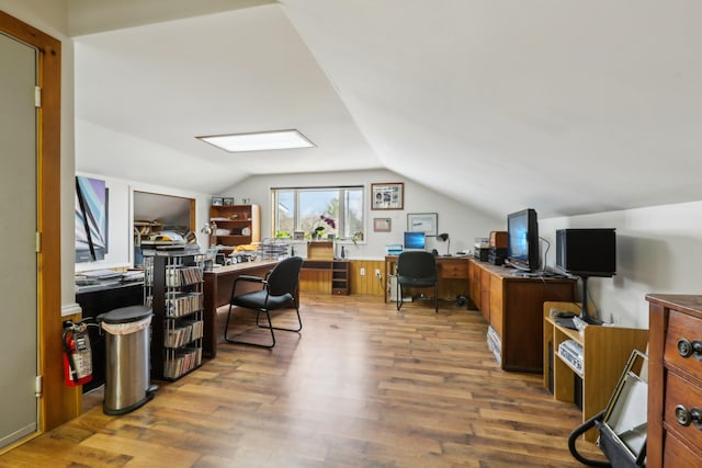 office featuring wood finished floors and vaulted ceiling