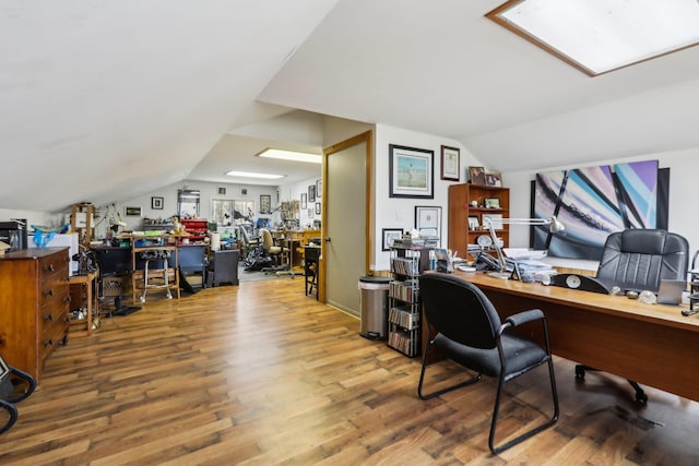 office area featuring wood finished floors and lofted ceiling