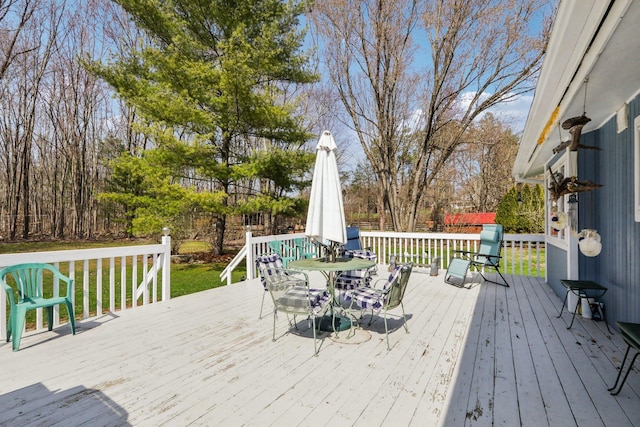 deck featuring outdoor dining area