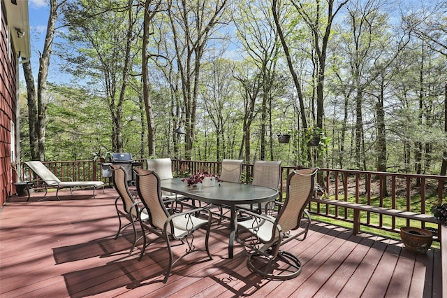 deck with outdoor dining area
