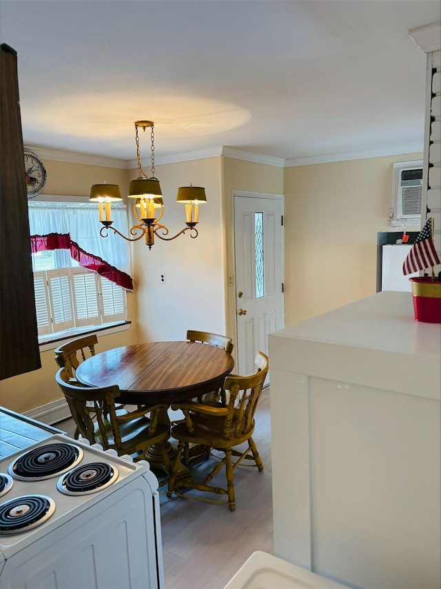 dining room featuring an AC wall unit, ornamental molding, a chandelier, and light wood-style floors