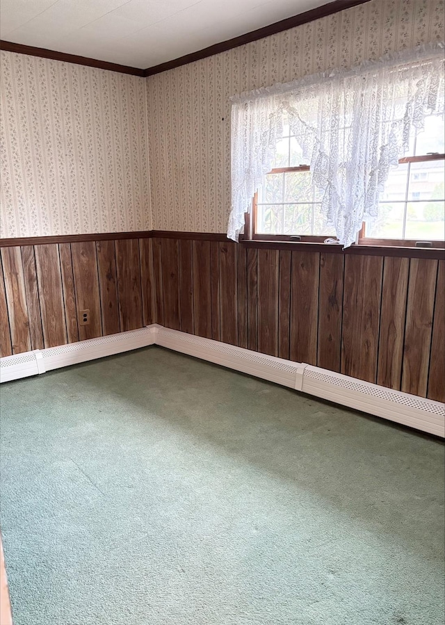 empty room featuring carpet floors, ornamental molding, and plenty of natural light