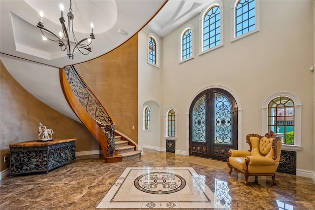 117 Malba Dr, Malba, NY 11357 - foyer entrance with a high ceiling, marble finish floor, baseboards, and an inviting chandelier