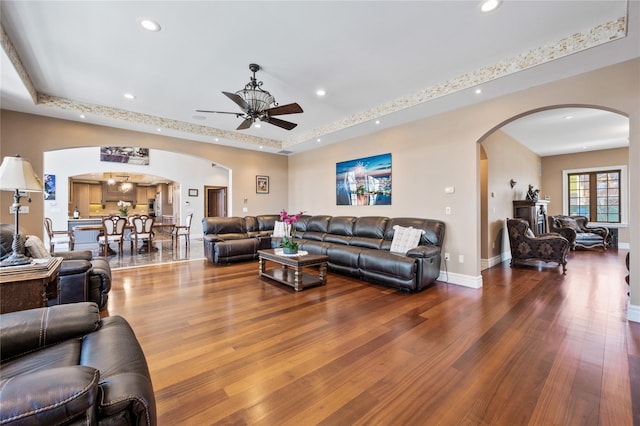 117 Malba Dr, Malba, NY 11357 - living room featuring arched walkways, wood finished floors, and recessed lighting