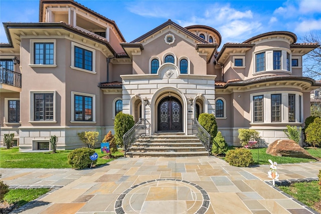 117 Malba Dr, Malba, NY 11357 - view of front of property with french doors, a tiled roof, and stucco siding