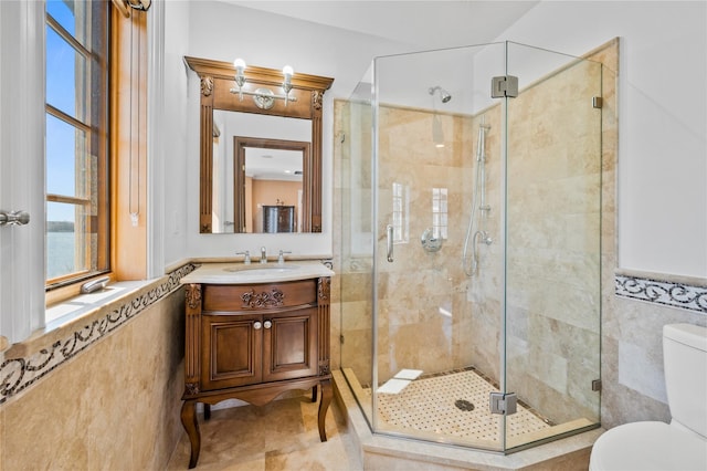 117 Malba Dr, Malba, NY 11357 - full bath with a shower stall, toilet, vanity, and tile walls