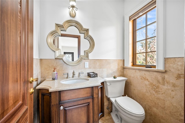 117 Malba Dr, Malba, NY 11357 - half bath with wainscoting, toilet, a healthy amount of sunlight, and vanity