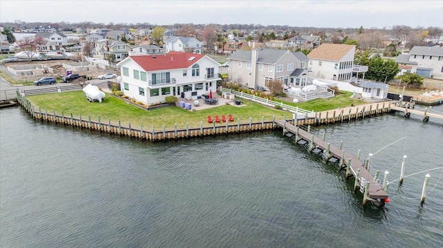 aerial view with a residential view and a water view