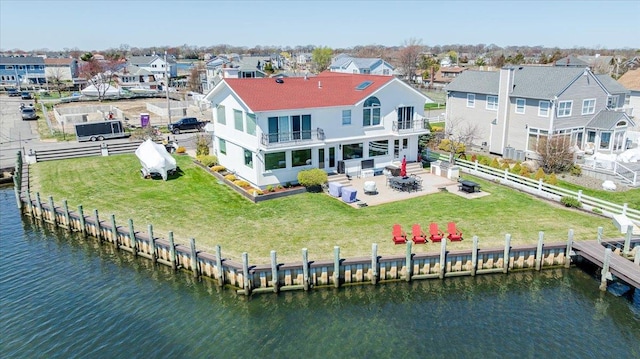 birds eye view of property with a residential view and a water view