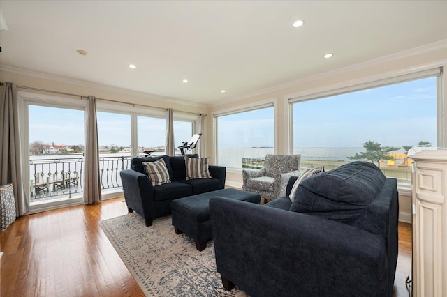 living room with recessed lighting, wood finished floors, and crown molding