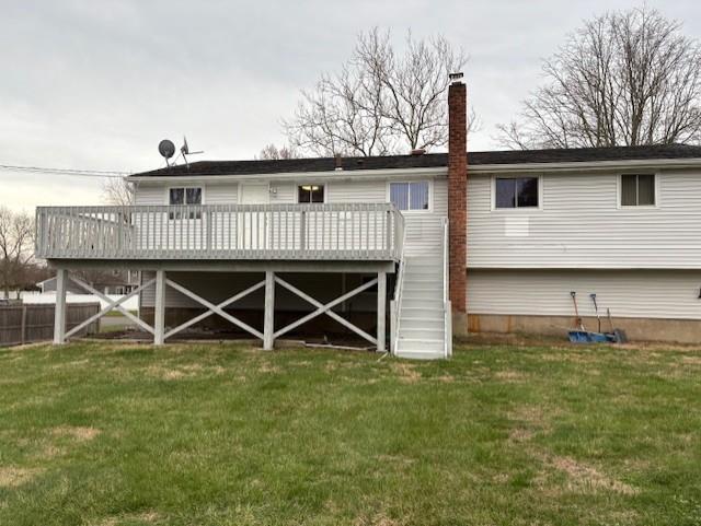 19 Yeoman Dr, East Northport, NY 11731 - back of house featuring a lawn, a deck, and a chimney