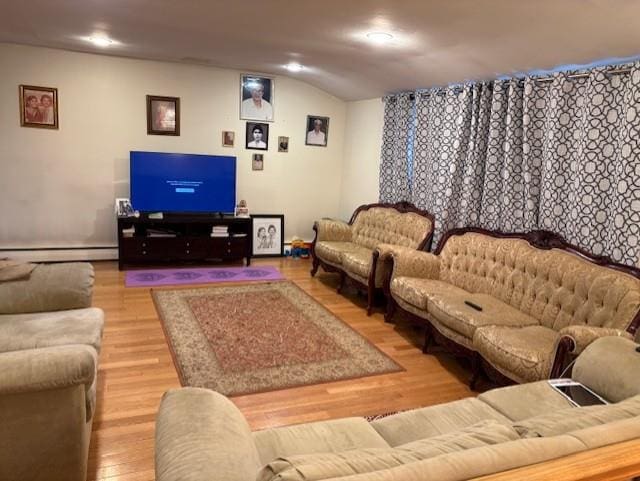 19 Yeoman Dr, East Northport, NY 11731 - living room with baseboard heating and wood finished floors