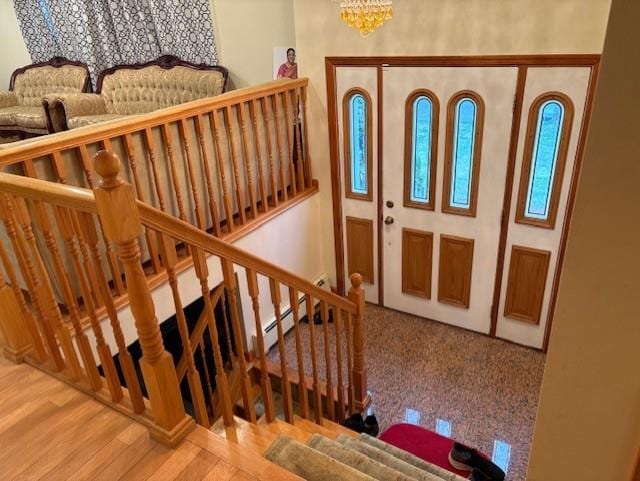 19 Yeoman Dr, East Northport, NY 11731 - foyer entrance featuring an inviting chandelier and wood finished floors