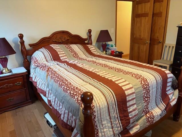19 Yeoman Dr, East Northport, NY 11731 - bedroom with light wood-style flooring