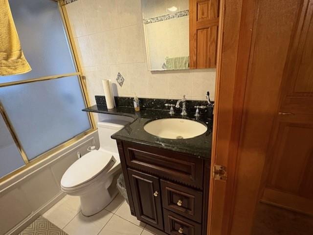 19 Yeoman Dr, East Northport, NY 11731 - full bathroom with toilet, vanity, enclosed tub / shower combo, tile patterned flooring, and tile walls