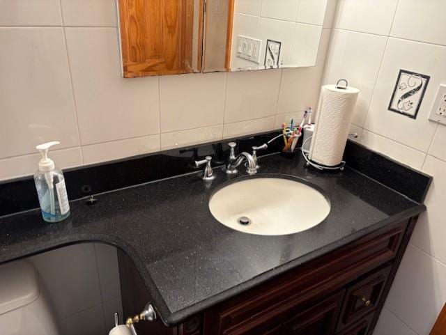 19 Yeoman Dr, East Northport, NY 11731 - bathroom featuring tile walls, backsplash, and vanity