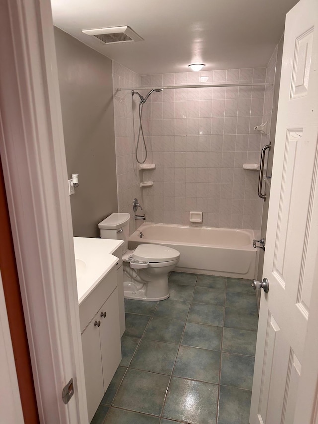 full bath featuring  shower combination, toilet, visible vents, tile patterned flooring, and vanity