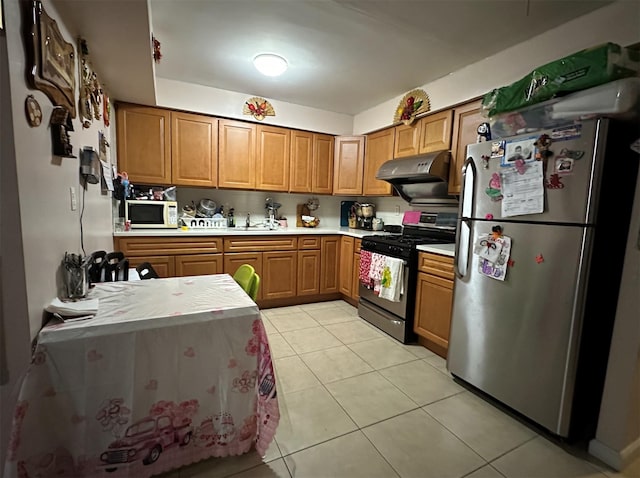 108-14 35th Ave, Corona, NY 11368 - kitchen featuring light countertops, a sink, appliances with stainless steel finishes, under cabinet range hood, and light tile patterned floors