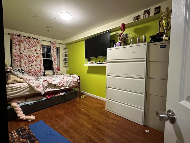 108-14 35th Ave, Corona, NY 11368 - bedroom with baseboards and wood finished floors
