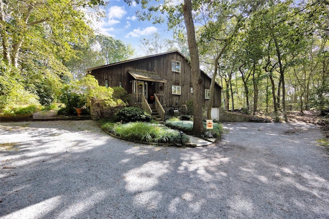 18 Warner Ct, Baiting Hollow, NY 11933 - view of front facade featuring driveway and a garage