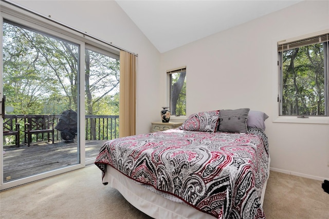 18 Warner Ct, Baiting Hollow, NY 11933 - carpeted bedroom with access to outside, baseboards, multiple windows, and lofted ceiling