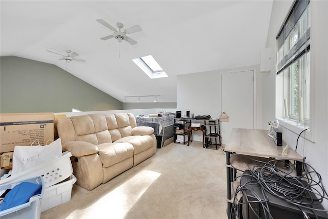 18 Warner Ct, Baiting Hollow, NY 11933 - living area with light carpet, rail lighting, lofted ceiling with skylight, and ceiling fan