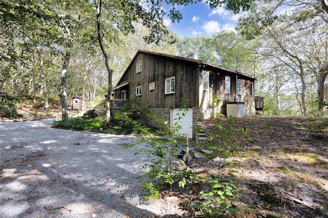 18 Warner Ct, Baiting Hollow, NY 11933 - view of home's exterior featuring stone siding