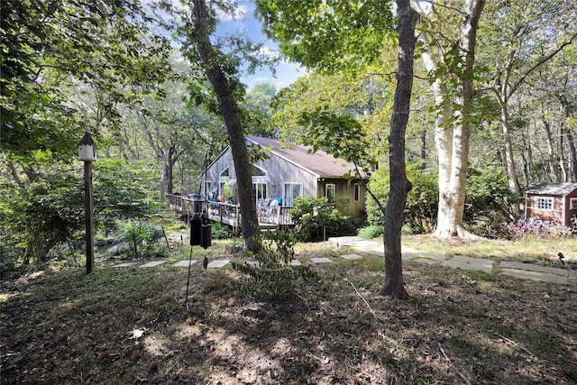 18 Warner Ct, Baiting Hollow, NY 11933 - view of yard featuring a forest view and a wooden deck
