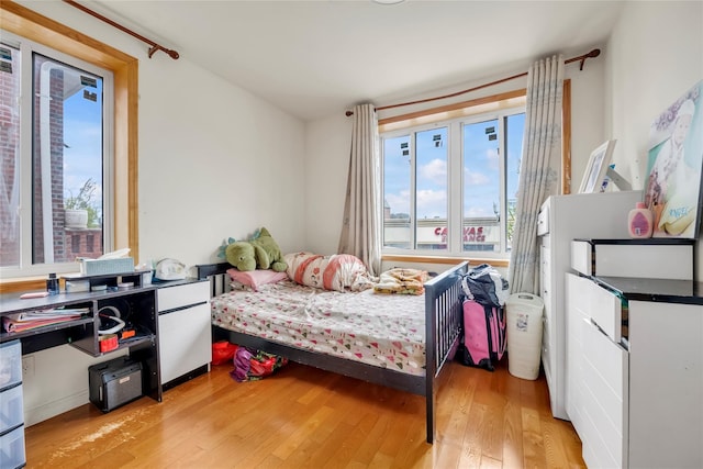 bedroom featuring light wood-style floors