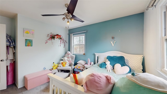 carpeted bedroom featuring ceiling fan