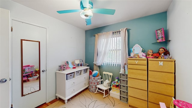 bedroom with ceiling fan and light wood-style flooring