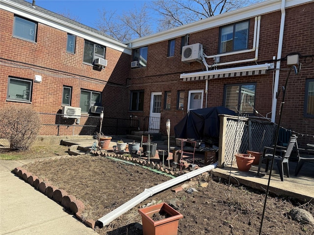 69-02 Springfield Blvd Duplex, Unit Duplex, Oakland Gardens, NY 11364 - back of property featuring brick siding, cooling unit, a patio area, and ac unit