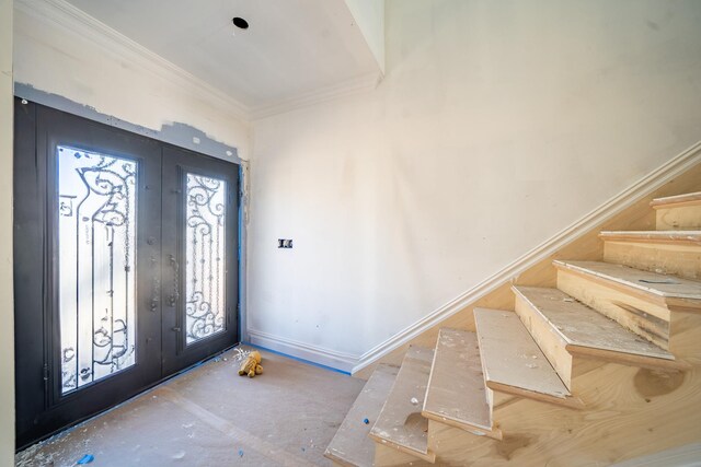 49 E Cherry St, Hicksville, NY 11801 - foyer with french doors, stairway, ornamental molding, and baseboards