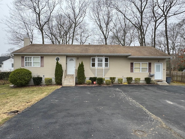 1343 William Floyd Pkwy, Shirley, NY 11967 - ranch-style house featuring entry steps, fence, and a chimney