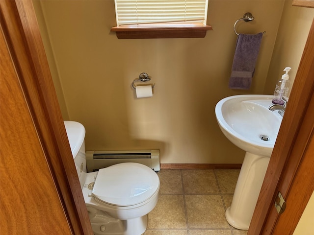 1343 William Floyd Pkwy, Shirley, NY 11967 - bathroom featuring toilet, tile patterned floors, a baseboard heating unit, and baseboards