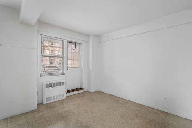 89-15 Parsons Blvd Unit 3J, Jamaica, NY 11432 - empty room with tile patterned floors and radiator