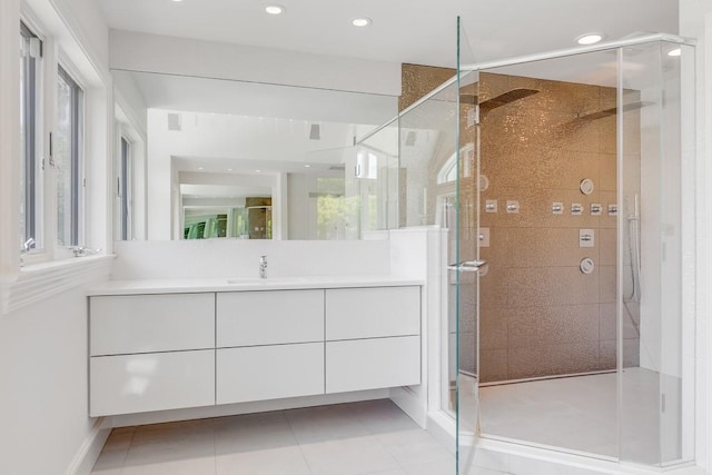 full bathroom with tile patterned floors, recessed lighting, vanity, and a stall shower