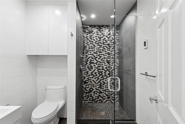 full bath featuring toilet and a shower stall
