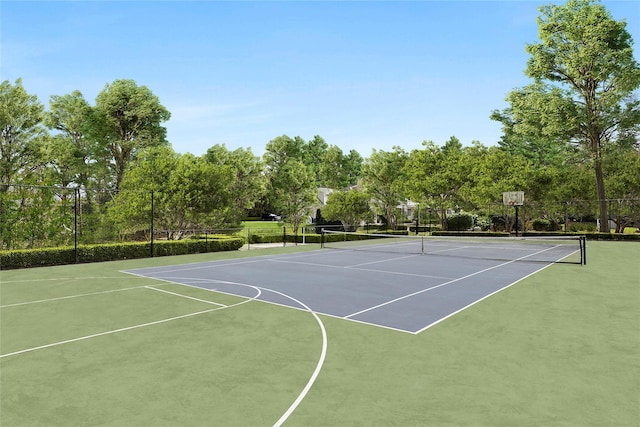 view of tennis court with community basketball court and fence