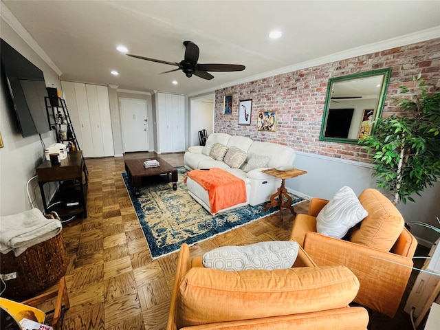living room featuring ornamental molding, ceiling fan, recessed lighting, and brick wall