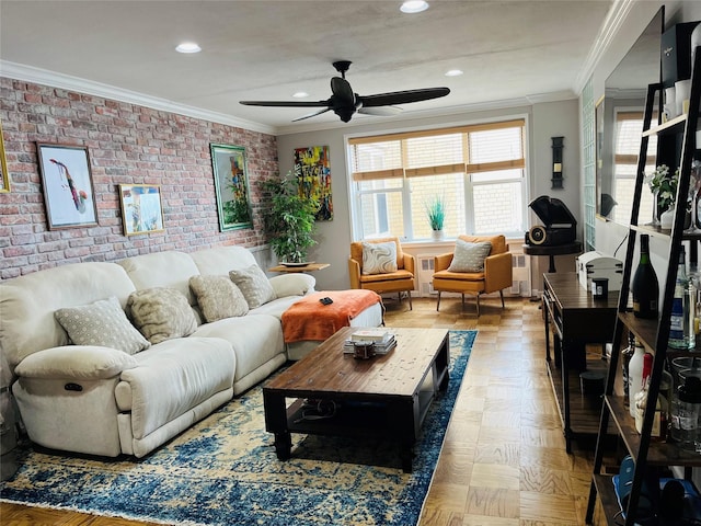living room with crown molding, ceiling fan, an accent wall, recessed lighting, and brick wall