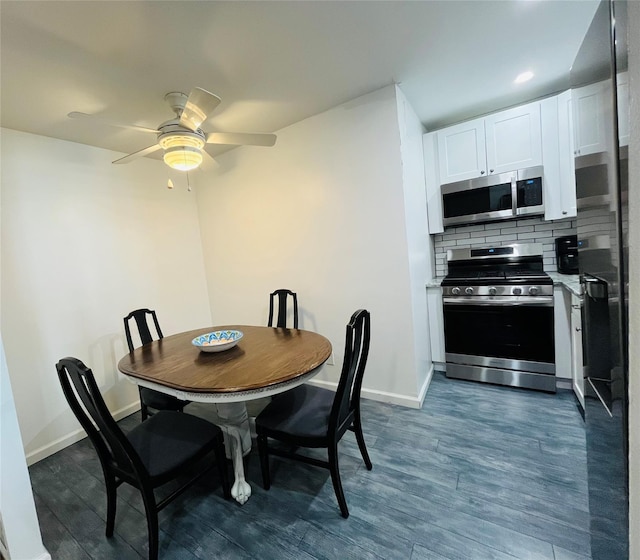 dining area with dark wood-style flooring, ceiling fan, and baseboards