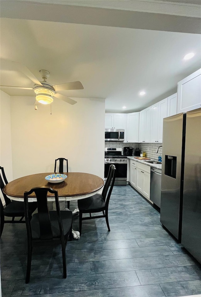 dining space with dark wood-type flooring, recessed lighting, and a ceiling fan