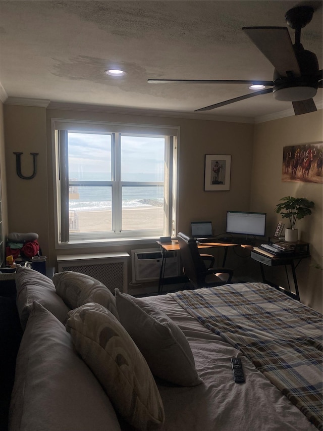 bedroom featuring a ceiling fan, radiator heating unit, and ornamental molding