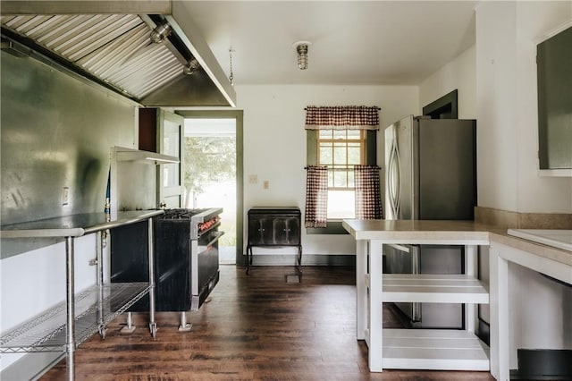 kitchen featuring stainless steel range and dark wood-style floors