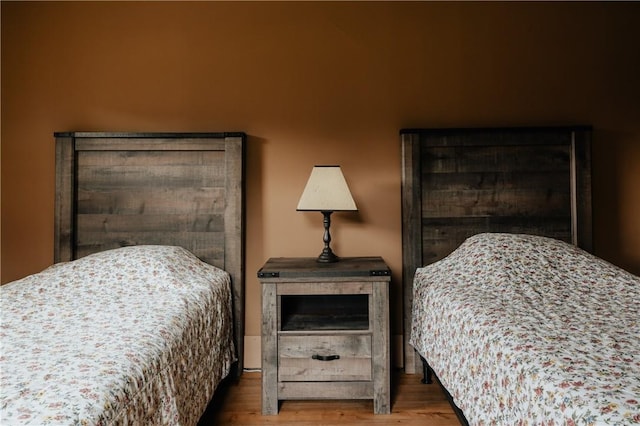bedroom featuring wood finished floors