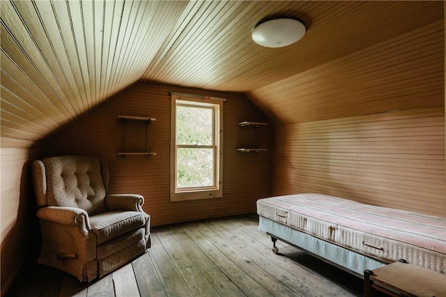 bedroom with wooden ceiling, hardwood / wood-style flooring, and lofted ceiling