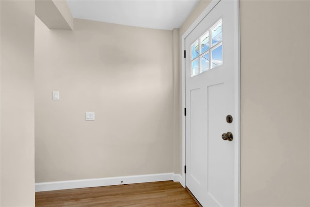 83 Fairview Ave, Islip Terrace, NY 11752 - foyer featuring baseboards and wood finished floors