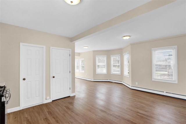 83 Fairview Ave, Islip Terrace, NY 11752 - unfurnished living room featuring baseboards and wood finished floors